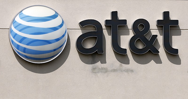 
              FILE - This May 14, 2014 file photo shows an AT&T logo on a store in Dedham, Mass. On Saturday, Oct. 22, 2016, several reports citing unnamed sources said the giant phone company is in advanced talks to buy Time Warner, owner of the Warner Bros. movie studio as well as HBO and CNN. AT&T is said to be offering $80 billion or more, a massive deal that would shake up the media landscape. (AP Photo/Steven Senne, File)
            