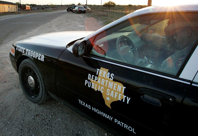 
              FILE - In this April 6, 2008, file photo, a Texas State Trooper is shown sitting in his vehicle in Eldorado, Texas. Drivers in Texas busted for drunken driving, not paying child support or low-level drug offenses are among thousands of "high-threat" criminal arrests that officials have touted in defense of a nearly $1 billion mission to secure the border with Mexico, an Associated Press analysis has found. (AP Photo/Tony Gutierrez, File)
            