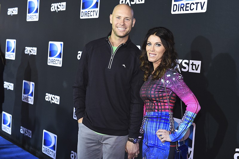 
              FILE - In this Saturday, Jan. 31, 2015, file photo, Josh Brown, left, and Molly Brown arrive at the 2015 DIRECTV Super Saturday Night at the Pendergast Family Farm, in Glendale, Ariz. Coach Ben McAdoo said Friday, Oct. 21, 2016,  that the New York Giants have not yet decided whether Josh Brown will remain on the team after admitting to abuse of his former wife. McAdoo faced repeated questioning about the kicker following the Giants' first practice in London for a game Sunday against the Los Angeles Rams.
 (Photo by Scott Roth/Invision/AP, File)
            