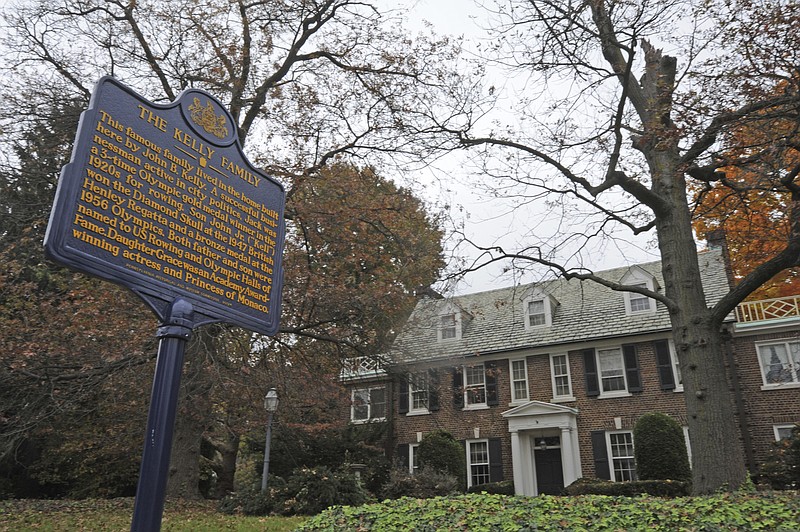 
              FILE - In this Oct. 25, 2012, file photo, a blue state historical marker sits outside Grace Kelly's family's home in Philadelphia. The Philadelphia home where Oscar-winning actress Kelly grew up and accepted a marriage proposal from Prince Rainier III of Monaco in 1955 is now in the hands of the royal family. Kelly’s son, Prince Albert, tells People Magazine, Friday, Oct. 21, 2016,  he was the recent purchaser of the East Falls home, which he called “very special to our family.” His mother, the beloved actress, died in 1982.(April Saul/The Philadelphia Inquirer via AP, File)
            
