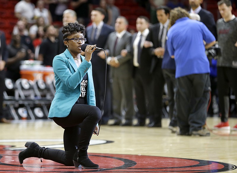 Denasia Lawrence sings the national anthem before an NBA preseason basketball game between the Miami Heat and the Philadelphia 76ers, Friday, Oct. 21, 2016, in Miami. (AP Photo/Alan Diaz)