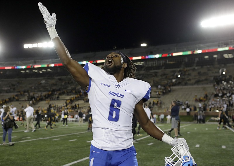Middle Tennessee cornerback Michael Minter celebrates as he runs off the field following an NCAA college football game against Missouri Saturday, Oct. 22, 2016, in Columbia, Mo. Middle Tennessee won 51-45. (AP Photo/Jeff Roberson)


