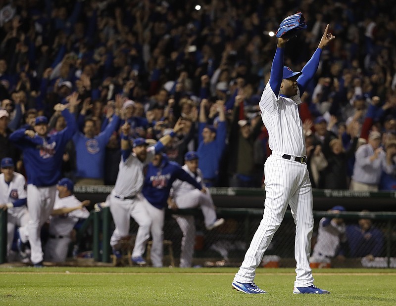 
              Chicago Cubs relief pitcher Aroldis Chapman (54) celebrates after Game 6 of the National League baseball championship series against the Los Angeles Dodgers, Saturday, Oct. 22, 2016, in Chicago. The Cubs won 5-0 to win the series and advance to the World Series against the Cleveland Indians. (AP Photo/David J. Phillip)
            