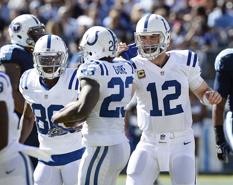 
              Indianapolis Colts quarterback Andrew Luck (12) celebrates with running back Frank Gore (23) after Gore scored a touchdown on a 3-yard pass reception against the Tennessee Titans in the first half of an NFL football game Sunday, Oct. 23, 2016, in Nashville, Tenn. (AP Photo/Mark Zaleski)
            
