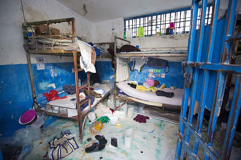 
              A prison cell is empty after inmates escaped from the Civil Prison in the coastal town of Arcahaiea, Haiti, Saturday, Oct. 22, 2016. Over 100 inmates escaped after they overpowered guards who were escorting them to a bathing area. (AP Photo/Dieu Nalio Chery)
            