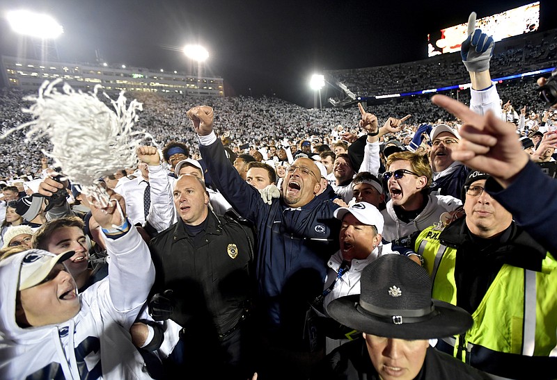 
              Penn State coach James Franklin, center, celebrates with the crowd after the team's 24-21 win over Ohio State during an NCAA college football game Saturday, Oct. 22, 2016, in State College, Pa. (Abby Drey/Centre Daily Times via AP)
            