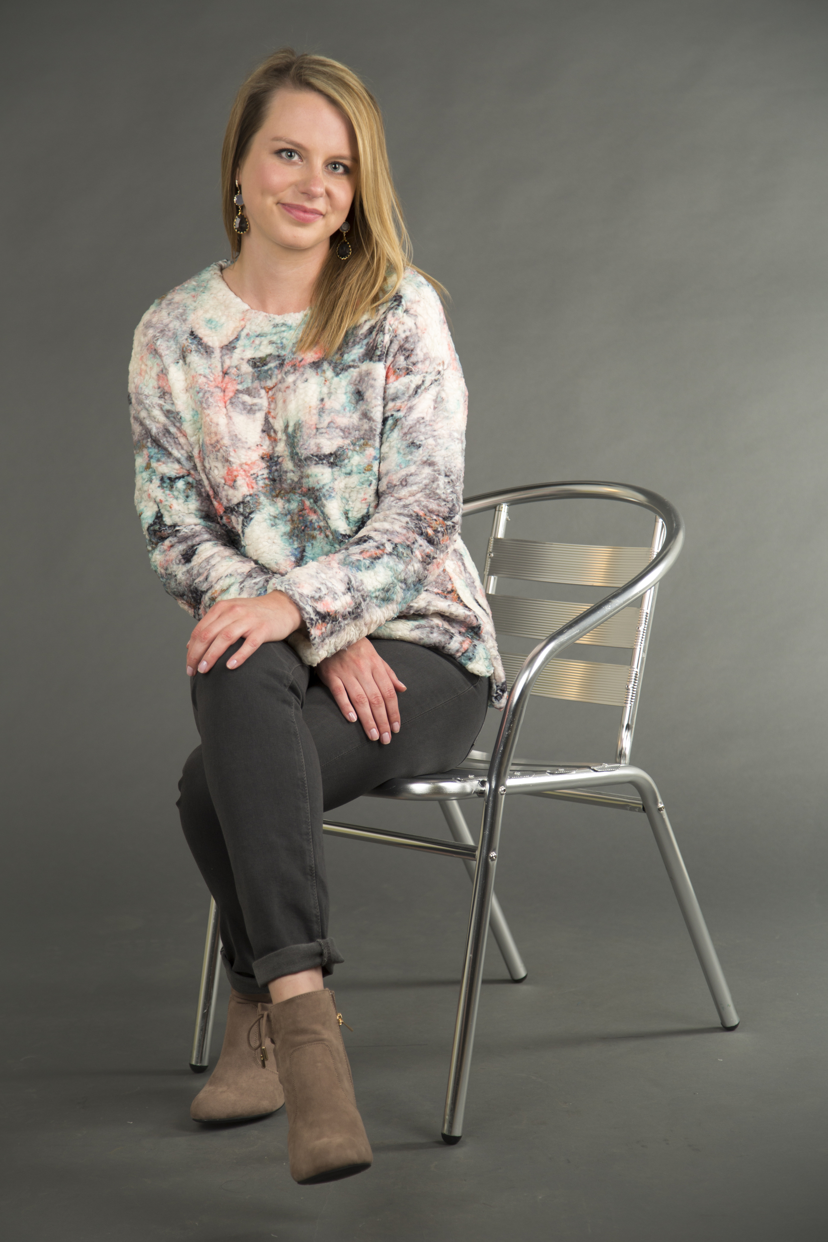 Floral print sweater and Bamboo Hilltop suede booties, both available at Fab'rik. Adriano Goldschmied mid-rise cigarette jean, available at Yacoubian Tailors. Teardrop earrings, available at Merch Northshore.
