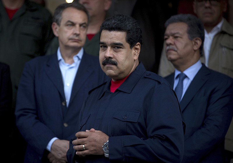 
              FILE - In this July 21, 2016 file photo, Venezuela's President Nicolas Maduro stands with Spain's former Prime Minister Jose Luis Rodriguez Zapatero, left, and former Dominican Republic President Leonel Fernandez, during a photo opportunity after a meeting at Miraflores presidential palace in Caracas, Venezuela. Venezuela’s government says Pope Francis met with Maduro at the Vatican on Monday, Oct. 24, 2016. (AP Photo/Fernando Llano, File)
            