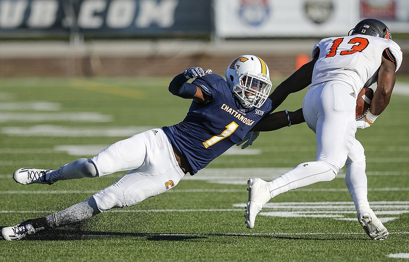 UTC defensive back Trevor Wright dives for Mercer wide receiver Chandler Curtis during the Mocs' home football game against the Mercer Bears at Finley Stadium on Saturday, Oct. 8, 2016, in Chattanooga, Tenn.