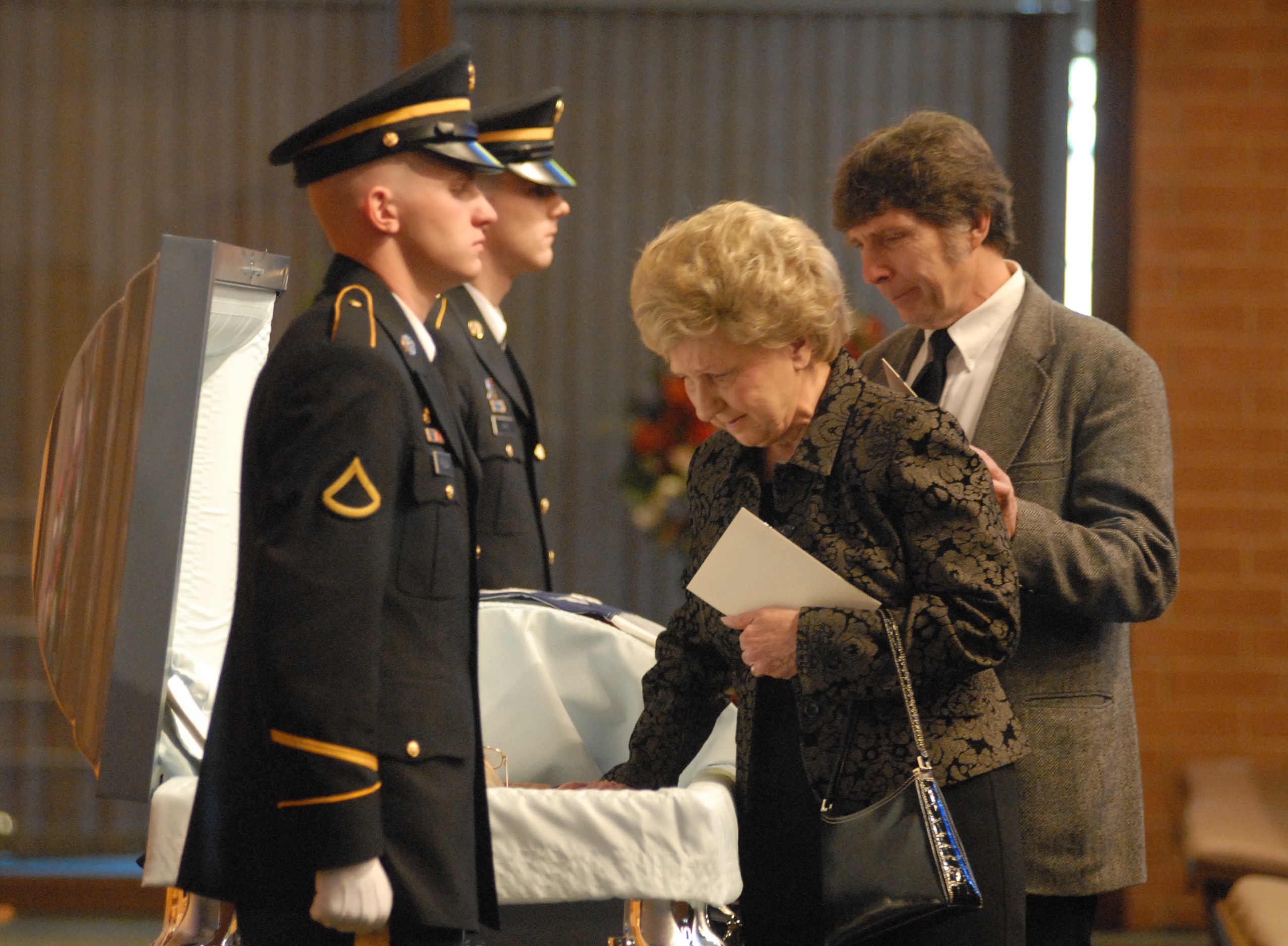 Gloria Bareford, center, and Desmond Doss, Jr., right, say final goodbyes Desmond Doss, Sr. before the funeral service at Collegedale Seventh-Day Adventist Church in Collegedale in 2006. Desmond Doss Sr. received the Congressional Medal of Honor by President Harry Truman in 1945 for his acts of bravery during World War II. PFC David Fuqua, left, and PFC Chase Warren with the Tennessee Army National Guard Military Funeral Honors Detail attend the casket.