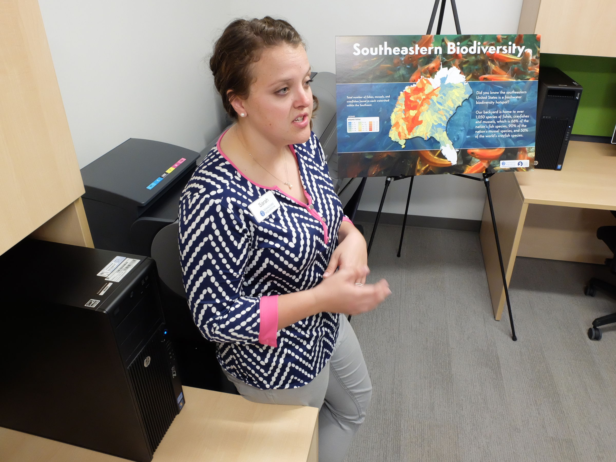 Sarah Sweat, GIS Analyst, talks to invited guests Monday inside the recently completed Tennessee Aquarium Conservation Institute on the Tennessee River near the Baylor School campus.