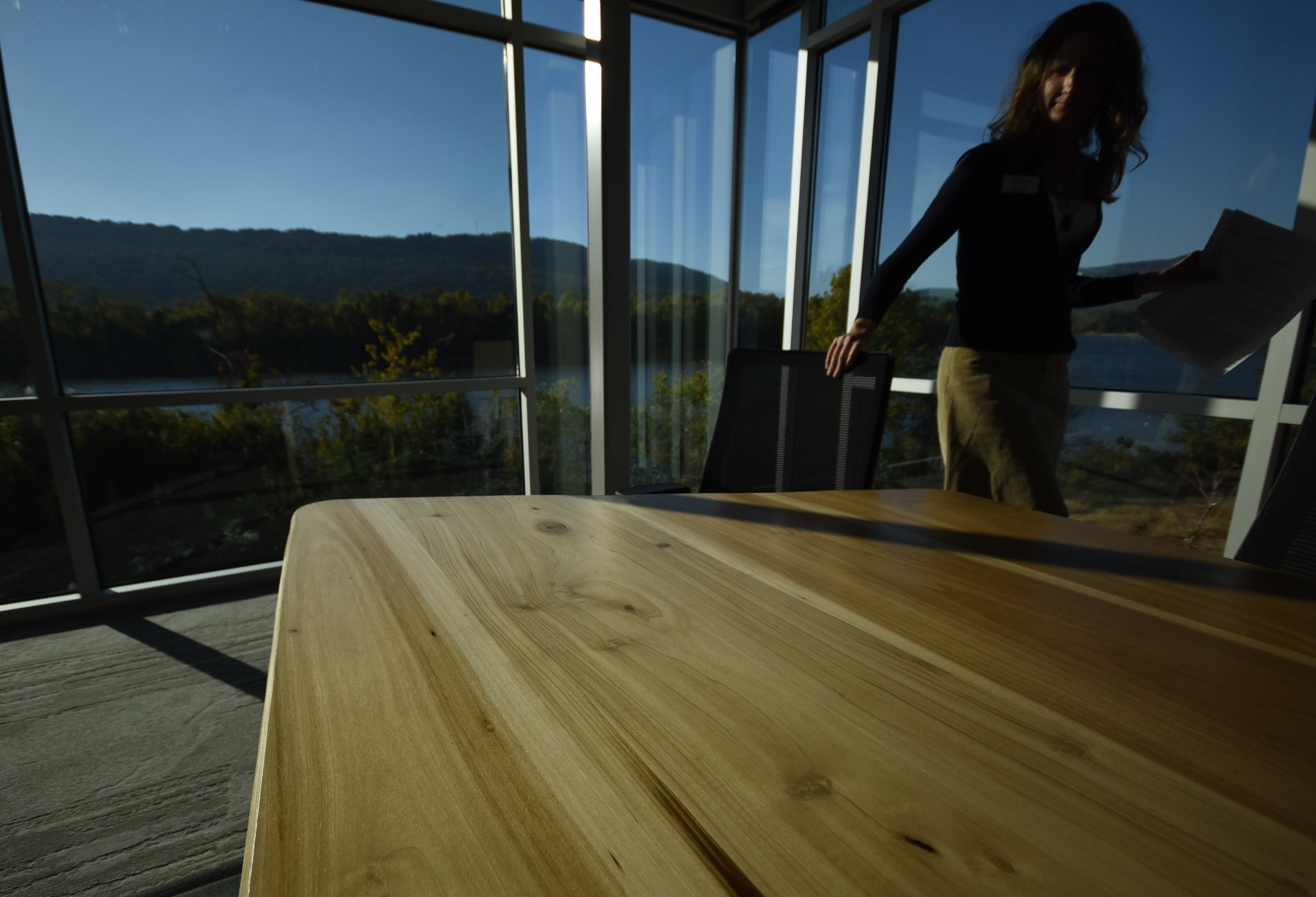 The conference room table at the Tennessee Aquarium Conservation Institute was made from Elder Mountain poplar wood by Eric Collins. The table's location in the institute's conference room overlooks Elder Mountain, at left.