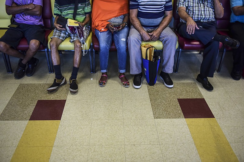 
              In this Oct. 24, 2016 photo, patients wait their turn at one of the Medical Center external clinics in San Juan, Puerto Rico. A steady departure of medical specialists from Puerto Rico has turned into a stampede amid the island's ongoing economic crisis leaving patients with few doctors to take care of their ills. (AP Photo/Carlos Giusti)
            