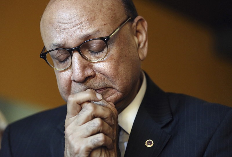 
              Khizr Khan, whose son was killed in Iraq and who criticized Republican presidential candidate Donald Trump's statements about Muslims, tries to control his emotions as he thanks civic leaders for paving the way for civil rights while he campaigns for Democratic presidential nominee Hillary Clinton at Croaker's Spot restaurant in Norfolk, Va., on Wednesday, Oct. 26, 2016. (Steve Earley/The Virginian-Pilot via AP)
            
