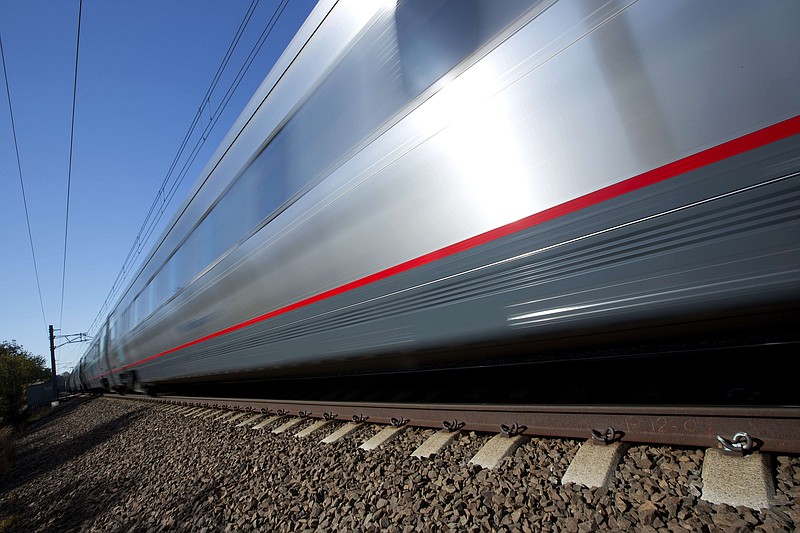 
              In this Tuesday, Oct. 18, 2016 photo, an Amtrak Acela train travels through Old Lyme, Conn. A plan to speed up Amtrak's high-speed rail corridor from Boston to Washington, D.C., is welcomed by business commuters but finding its strongest opposition in some shoreline towns in Connecticut. (AP Photo/Michael Dwyer)
            