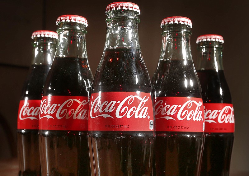 
              This Thursday, April 28, 2016, photo shows bottles of Coca-Cola in Concord, N.H. Coca-Cola Co. reports financial results Wednesday, Oct. 26, 2016. (AP Photo/Jim Cole)
            