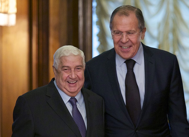 
              Russian Foreign Minister Sergey Lavrov, right, welcomes his Syrian counterpart Walid al-Moallem during their meeting in Moscow, Russia, Friday, Oct. 28, 2016. (AP Photo/Ivan Sekretarev)
            