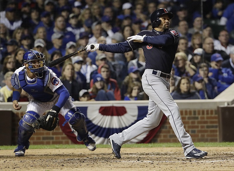
              Cleveland Indians' Coco Crisp hits an RBI single during the seventh inning of Game 3 of the Major League Baseball World Series against the Chicago Cubs Friday, Oct. 28, 2016, in Chicago. (AP Photo/David J. Phillip)
            