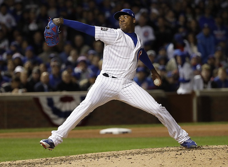 
              Chicago Cubs relief pitcher Aroldis Chapman throws during the seventh inning of Game 5 of the Major League Baseball World Series =ai-Sunday, Oct. 30, 2016, in Chicago. (AP Photo/David J. Phillip)
            