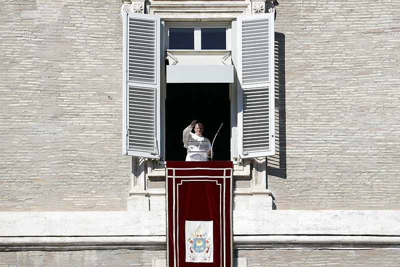 
              Pope Francis delivers his blessing during the Angelus noon prayer he celebrated from the window of his studio overlooking St. Peter's Square, at the Vatican, Sunday, Oct. 30, 2016. (AP Photo/Andrew Medichini)
            
