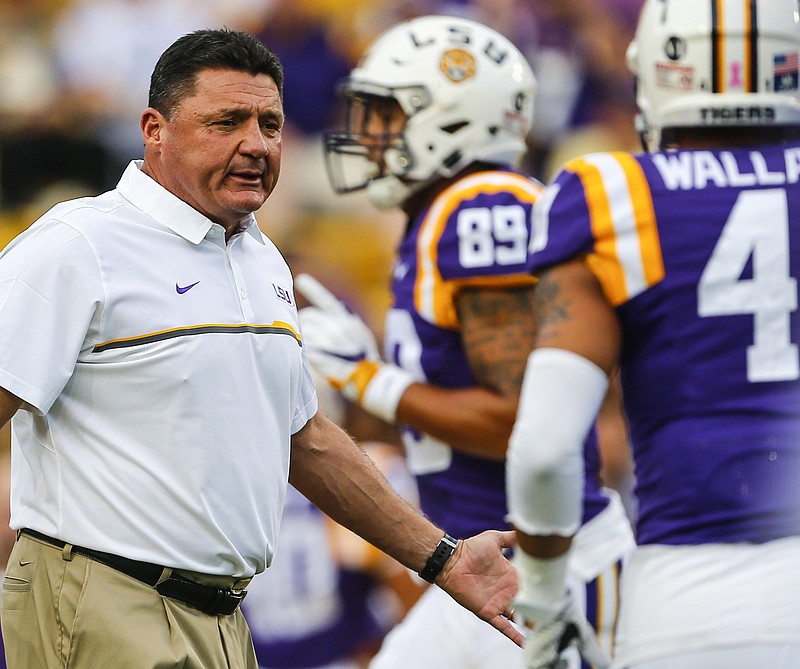 LSU head coach Ed Orgeron walks the field before an NCAA college football game against Southern Mississippi, Saturday, Oct. 15, 2016, in Baton Rouge, La. (AP Photo/Butch Dill)