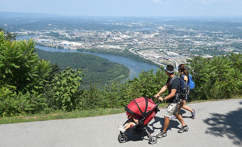 Staff file photo by Angela Lewis Foster / John and Lina Yun push Hannah as they enjoy the view August 28 at Point Park on Lookout Mountain.