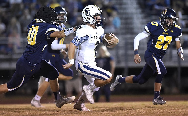Soddy-Daisy quarterback Justin Cooke (2) gains big yardage as Walker Valley's Syler Swafford (40) reaches from behind in their Oct. 6 matchup.