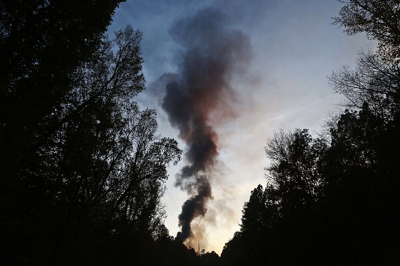 A plume of smoke rises from the site of an explosion on the Colonial Pipeline on Monday, Oct. 31, 2016, in Helena, Ala. Colonial Pipeline said in a statement that it has shut down its main pipeline in Alabama after the explosion in a rural part of the state outside Birmingham.
