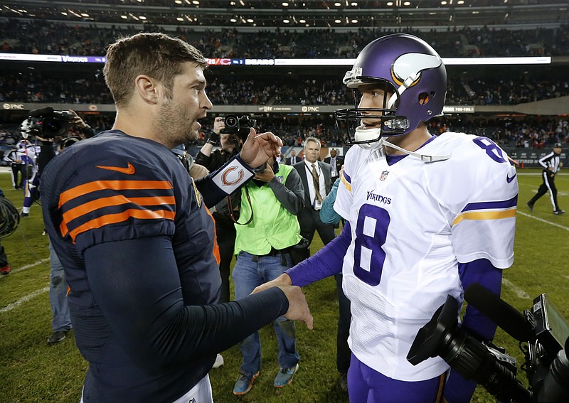 Chicago Bears quarterback Jay Cutler, left, and Minnesota Vikings quarterback Sam Bradford (8) talk after an NFL football game in Chicago, Monday, Oct. 31, 2016. Chicago won 20-10.