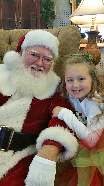 "Santa Fred" Oaks, shown here with granddaughter Reagan Bolin, will be back at Sugar Plum Antiques, 6509 Slater Road, behind the Cracker Barrel in East Ridge, to pose for free photos with children from 10 a.m. to 6 p.m. Saturday, Nov. 5, during the store's holiday open house. Call 423-894-2441 for more information.