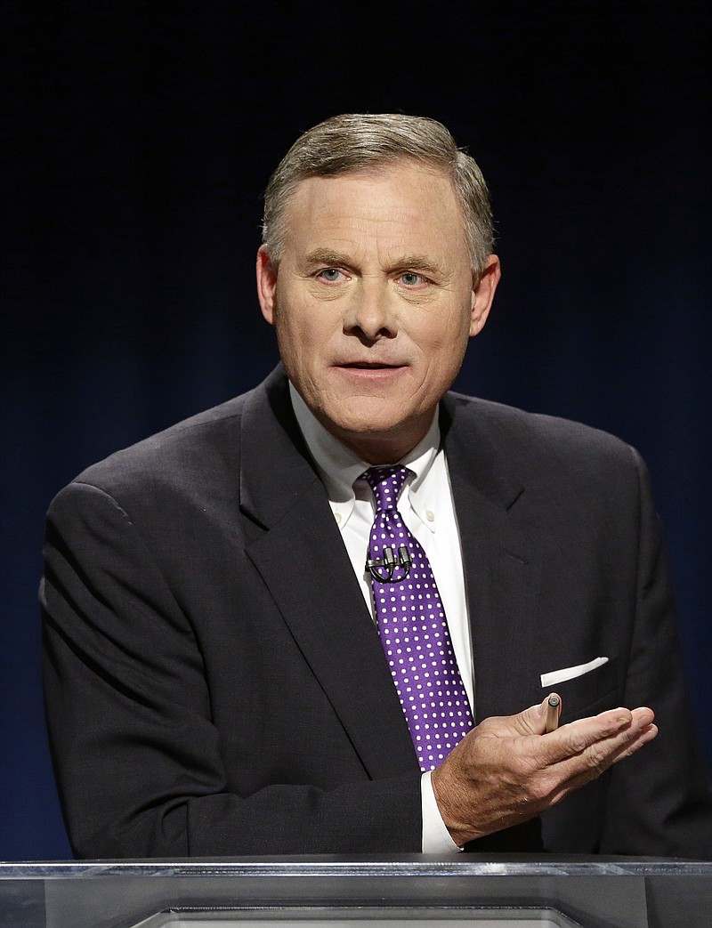 
              FILE-In this Thursday, Oct. 13, 2016 file photo, U.S. Sen. Richard Burr, R-N.C. makes a comment during a live televised Senate debate with Democratic challenger Deborah Ross at UNC-TV studios in Research Triangle Park, N.C. Burr is apologizing after he was caught telling Republican supporters that he was surprised Hillary Clinton appeared on the cover of a gun magazine without a bull's-eye on her face. (AP Photo/Gerry Broome, Pool)
            