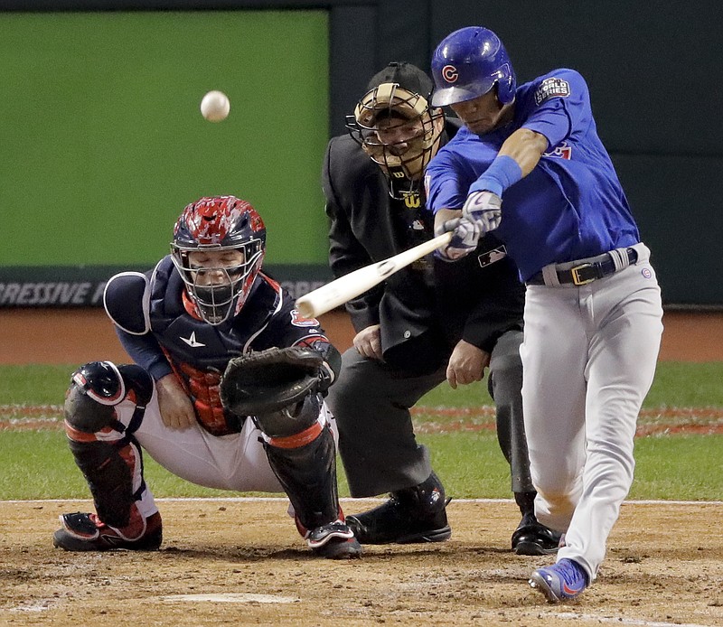 Chicago Cubs' Addison Russell hits a grand slam against the Cleveland Indians during the third inning of Game 6 of the Major League Baseball World Series Tuesday, Nov. 1, 2016, in Cleveland.