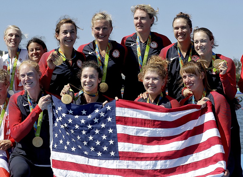 U.S. Olympic team members Amanda Polk, second from left, and Lauren Schmetterling, third from left, celebrate winning gold in the women's rowing eight in August at the Rio de Janeiro Games. Polk and Schmetterling will be special guests this week at the Head of the Hooch regatta in Chattanooga.