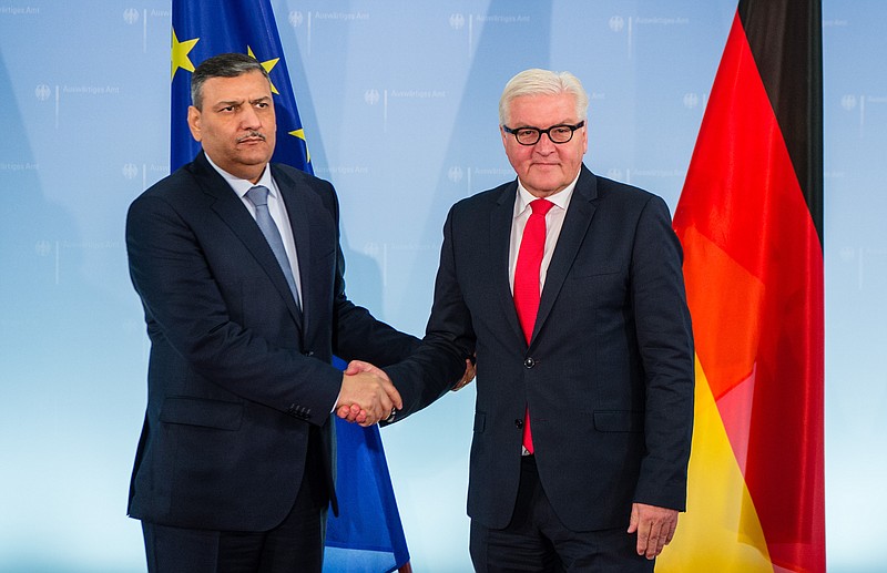 
              Former Syrian  Prime Minister Dr Riyad Farid Hijab, now coordinator  of the High Negotiations Committee of the Syrian Opposition (HNC) , left, shakes hands with German foreign minister Frank-Walter Steinmeier during their meeting in Berlin, Thursday Nov. 3, 2016.  (Sebastian Gollnow/dpa via AP)
            