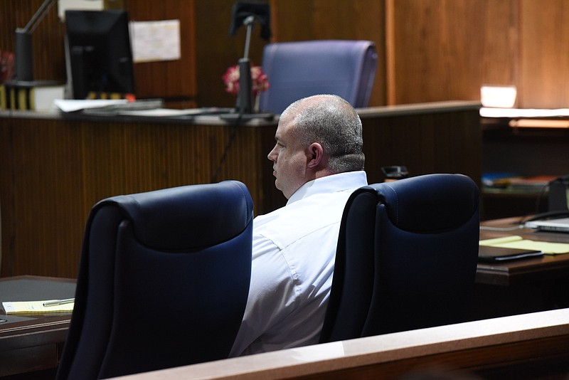 Red Bank Officer Mark Kaylor listens to proceeding in Judge Tom Greenholtz's courtroom on Tuesday afternoon. 