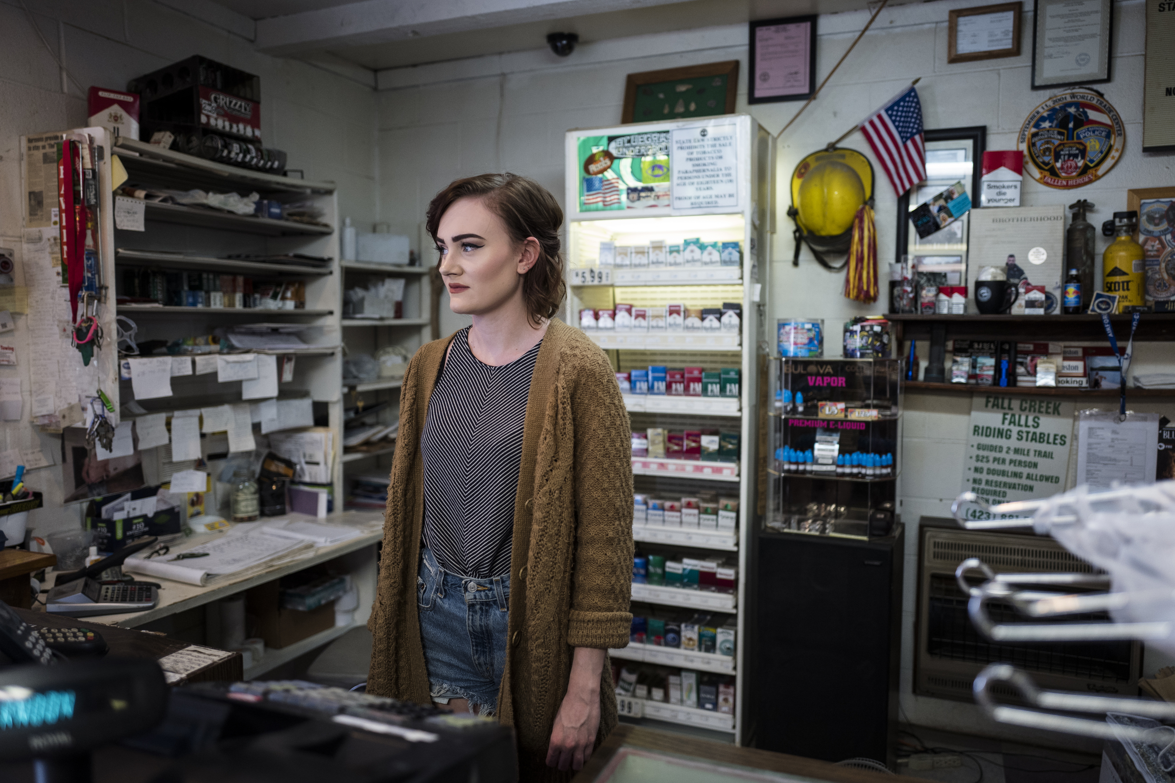 Kristen McCoy, who works at The Way Inn, a motel, gas station, and camp shop located on the route into Fall Creek Falls State Park, stands behind the counter in the store on Wednesday, Nov. 2, 2016, in Spencer, Tenn. A plan to demolish the park's existing inn and replace it with a new facility, which would take more than two years, could effect surrounding communities that depend on traffic to the park.