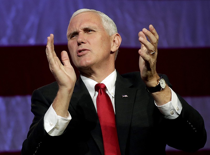 
              Republican vice presidential candidate, Indiana Gov. Mike Pence greets the crowd at a campaign stop, Wednesday, Nov. 2, 2016, in Mesa, Ariz. (AP Photo/Matt York)
            