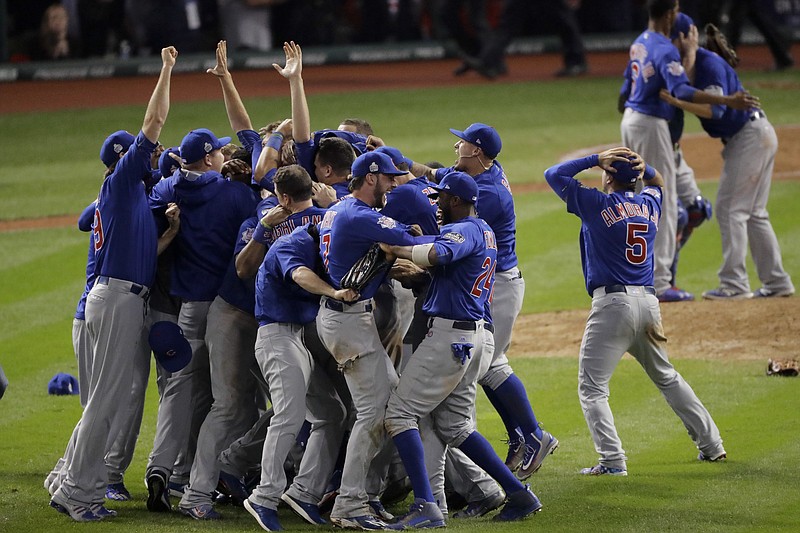 Chicago Cubs celebrate after Game 7 of the Major League Baseball World Series against the Cleveland Indians Thursday, Nov. 3, 2016, in Cleveland. The Cubs won 8-7 in 10 innings to win the series 4-3. (AP Photo/Charlie Riedel)


