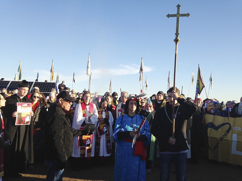 Members of the clergy join protesters against the Dakota Access oil pipeline in southern North Dakota near Cannon Ball on Thursday, Nov. 3, 2016, to draw attention to the concerns of the Standing Rock Sioux and push elected officials to call for a halt to construction. The tribe says the $3.8 billion, four-state pipeline threatens its drinking water and cultural sites. (AP Photo/James MacPherson)


