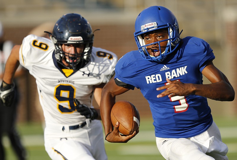 Red Bank's Calvin Jackson leads ahead of Walker Valley's Dylan Towers during their football game in the prep football jamboree at Finley Stadium on Saturday, Aug. 13, 2016, in Chattanooga, Tenn.