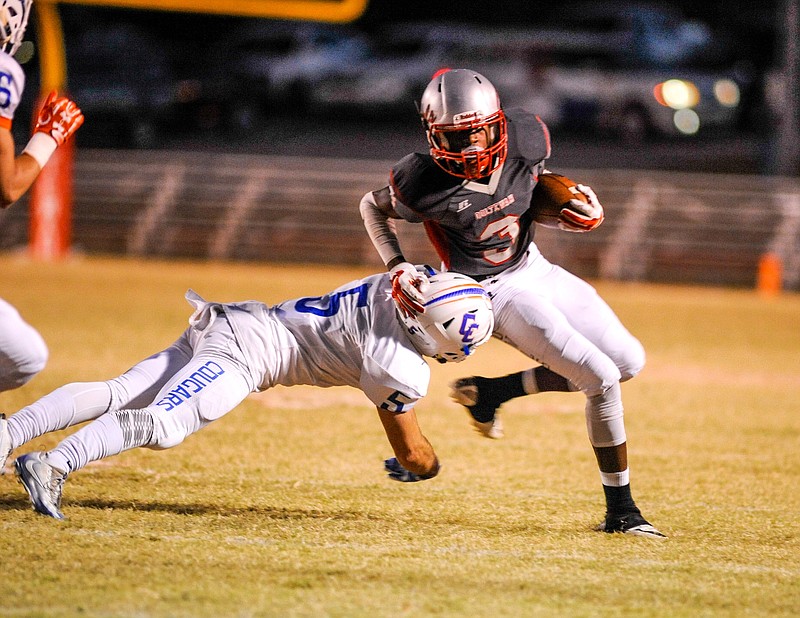 (Photo by Mark Gilliland) Ooltewah's Sincere Quinn tries to avoid Campbell County's Max Farris  tackle during the game on November 4, 2016.