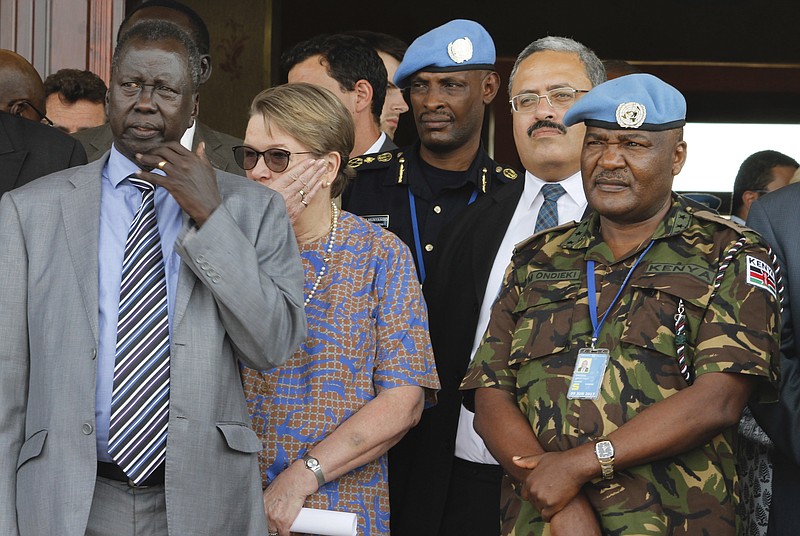 
              In this photo taken Friday, Sept. 2, 2016, United Nations Mission in South Sudan (UNMISS) force commander Lt. Gen. Johnson Mogoa Kimani Ondieki of Kenya, right, stands next to Ellen Loj, center, Special Representative of the UN Secretary-General, and an unidentified member of South Sudan's government, left, as they await a delegation of U.N. Security Council members, in Juba, South Sudan. Kenya's foreign affairs ministry said Wednesday, Nov. 2, 2016 that it is pulling out its 1,000 troops deployed to South Sudan as part of the U.N. peacekeeping mission after the U.N. secretary-general fired the force's Kenyan commander. (AP Photo/Justin Lynch)
            