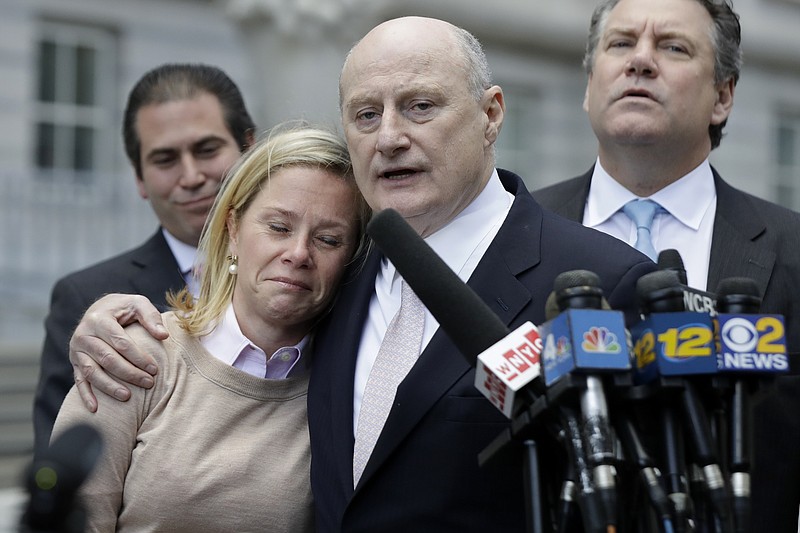 Bridget Anne Kelly, left, former Deputy Chief of Staff for New Jersey Gov. Chris Christie, is held by her lawyer Michael Critchley while talking to reporters after she was found guilty on all counts in the George Washington Bridge traffic trial at Martin Luther King, Jr., Federal Court, Friday, Nov. 4, 2016, in Newark, N.J. (AP Photo/Julio Cortez)


