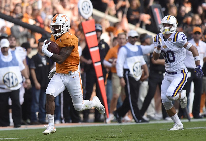 Staff Photo by Robin Rudd
John Kelly (4) breaks loose for a long Tennessee touchdown run. The Tennessee Tech Golden Eagles visited the Tennessee Volunteers in NCAA football action at Neyland Stadium in Knoxville on November 5, 2016.