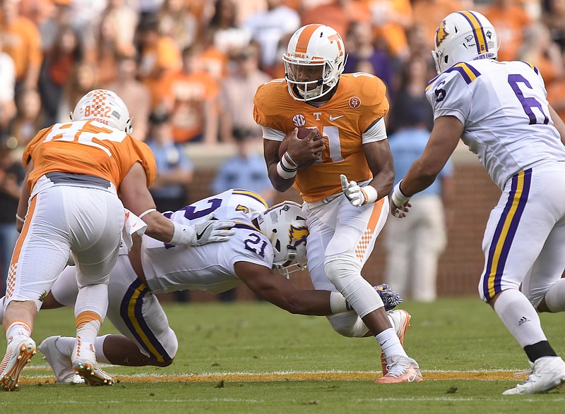 Tennessee quarterback Joshua Dobbs (11) picks up yardage.  The Tennessee Tech Golden Eagles visited the Tennessee Volunteers in NCAA football action at Neyland Stadium in Knoxville on November 5, 2016.