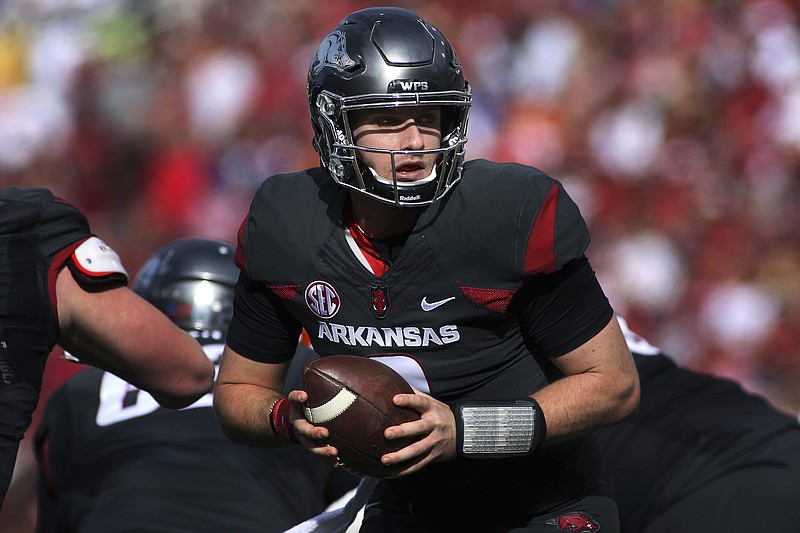 Arkansas' Austin Allen (8) looks to hand off during the first half of an NCAA college football game against Florida Saturday, Nov. 5, 2016, in Fayetteville, Ark. (AP Photo/Samantha Baker)