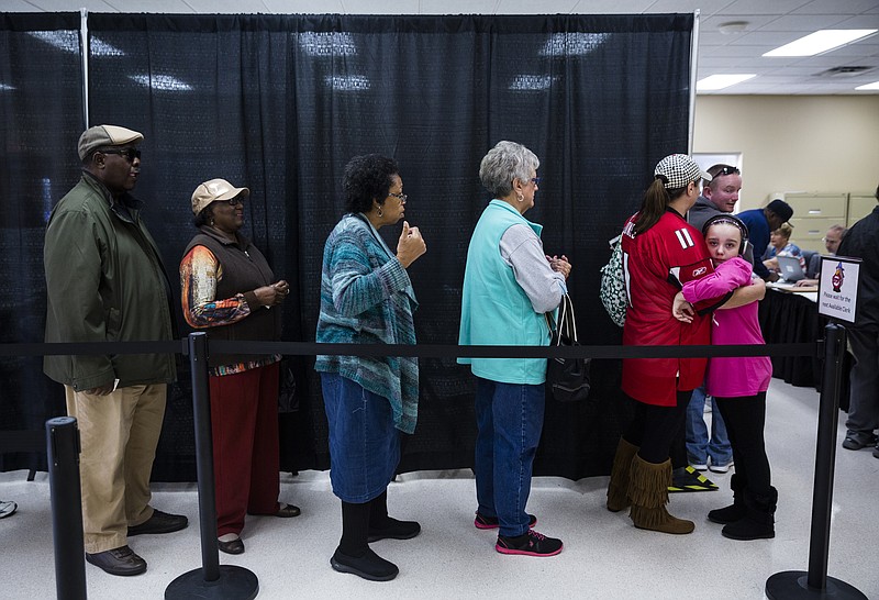 Staff photo by Doug Strickland / Voters wait in line to cast their ballots during early voting at the Hamilton County Election Commission on Amnicola Highway on Saturday, Oct. 22, 2016, in Chattanooga, Tenn.