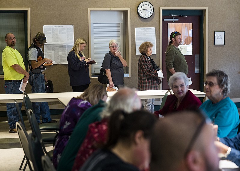 Voters wait in line to cast their ballots on election day at the Rossville Civic Center on Tuesday, Nov. 8, 2016, in Rossville, Ga. Walker County voters cast their ballots in a race between commissioner candidates Perry Lamb, Shannon Whitfield, and Bebe Heiskell.
