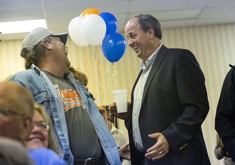 Republican Walker County commissioner candidate Shannon Whitfield, right, talks with Rusty Hays at an election return party at the Bank of Lafayette's community room on Tuesday, Nov. 8, 2016, in Lafayette, Ga.