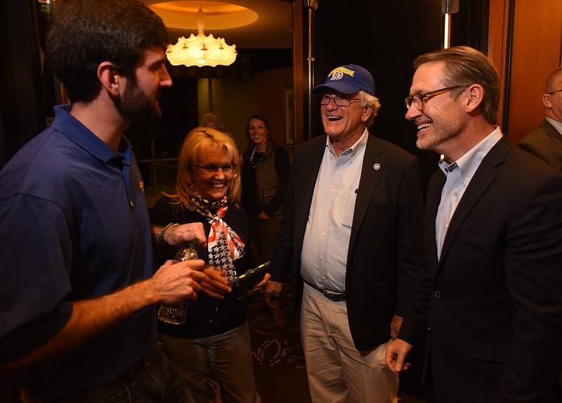 Tennessee State Senator Bo Watson, right, introduces Todd Gardenhire, second from right, as he enters the ballroom with his wife Sylvia, and son, Andrew, far left, prior to making his acceptance speech at the Double Tree hotel Tuesday night.